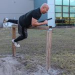 Participant climbing over wall